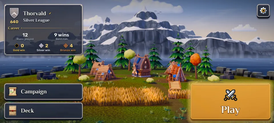 The game's main menu: a village under snowy mountains, with Campaign, Deck and Play buttons